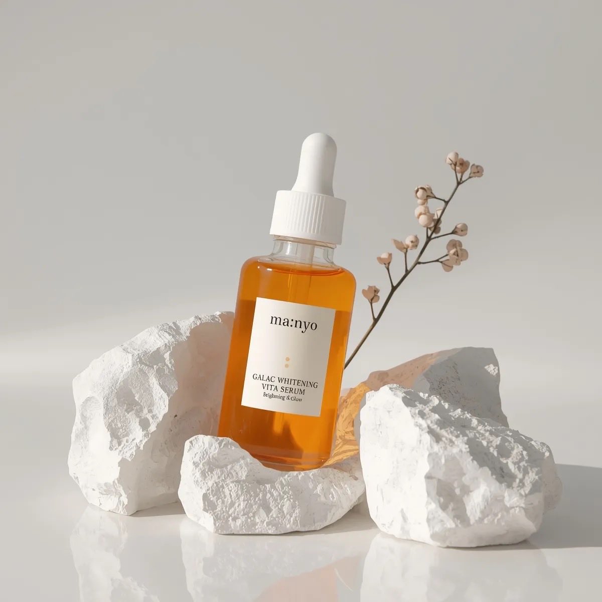 Minimalist studio product photography of an amber glass dropper serum bottle with white cap, labele…